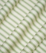 JF Ticking Warm Green striped fabric draped into soft, flowing folds, displaying the classic sage green and cream ticking stripe pattern and subtle herringbone texture.