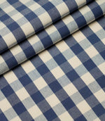 Folded blue and ivory small gingham check fabric highlighting the crisp woven pattern and premium quality finish.