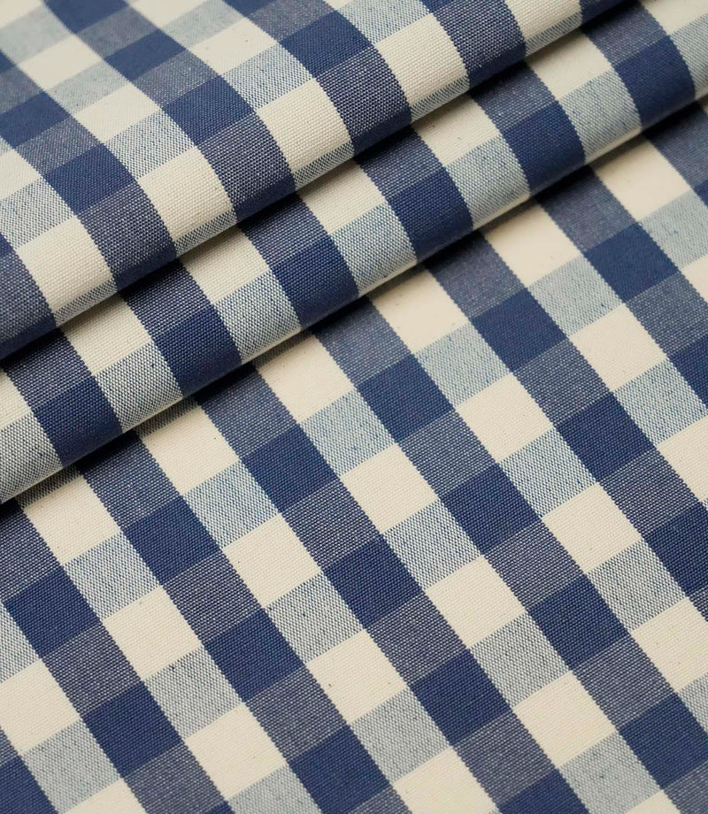 Folded blue and ivory small gingham check fabric highlighting the crisp woven pattern and premium quality finish.