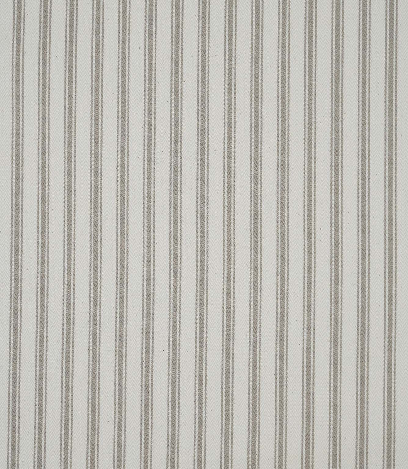 Close-up of beige ticking stripe fabric highlighting the delicate woven stripes and classic herringbone weave.