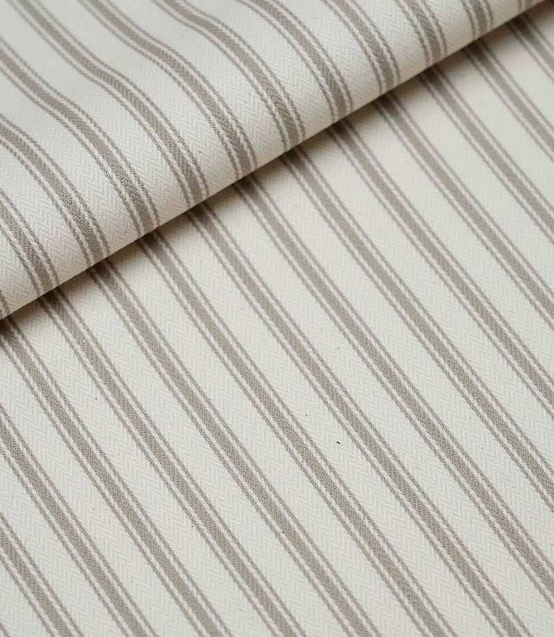 Folded beige ticking stripe fabric showcasing the classic striped design, woven texture and premium quality finish.