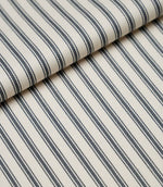 Folded grey ticking stripe fabric showcasing the timeless striped pattern and premium woven finish.