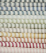 Ticking stripe fabric displayed alongside coordinating colourways from the Just Fabrics collection.