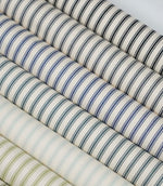 Collection of ticking stripe fabrics in a range of colours, featuring classic woven stripes on ivory backgrounds.