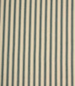 Classic indigo ticking stripe fabric with narrow blue stripes on a warm ivory background, featuring a subtle herringbone weave for a timeless country style.