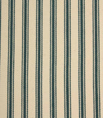 Close-up of indigo striped ticking fabric highlighting the textured woven finish, fine stripe detailing, and soft ivory base.