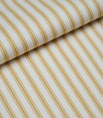 Folded ochre ticking stripe fabric showcasing the timeless striped pattern and premium woven herringbone finish.