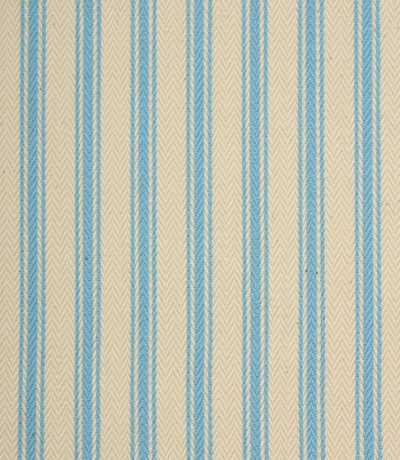 Close-up of ivory herringbone weave fabric featuring fine Pacific blue ticking stripes and textured detailing.