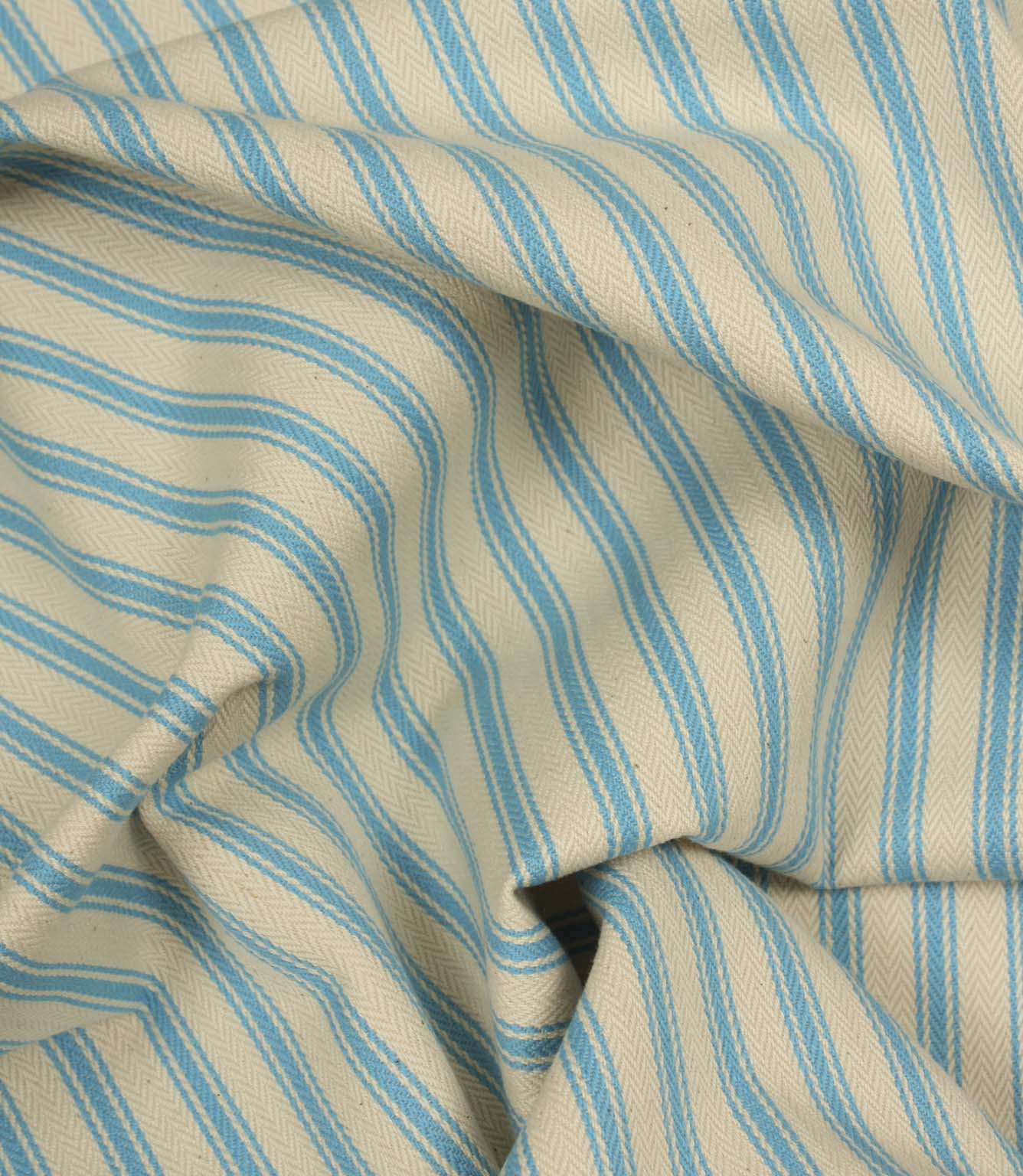 Gathered Pacific blue ticking stripe fabric showing natural folds and durable woven finish.