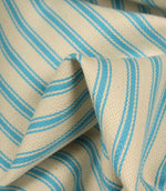 Detailed close-up of Pacific blue striped ticking fabric with visible herringbone weave and soft textured folds.