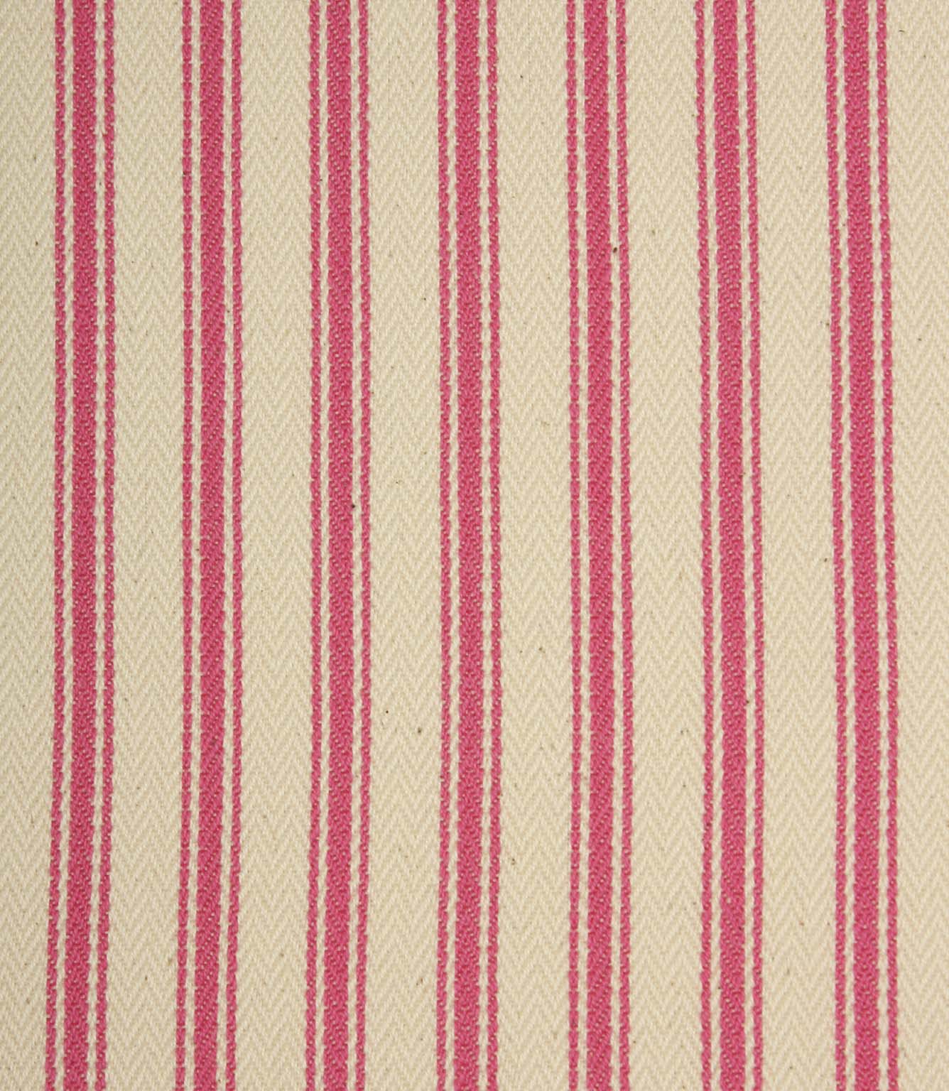 Close-up of ivory herringbone weave fabric featuring bold petunia pink ticking stripes and textured detailing.