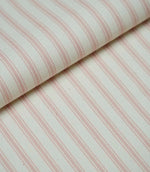 Folded pink ticking stripe fabric showcasing the timeless striped pattern and premium woven herringbone finish.