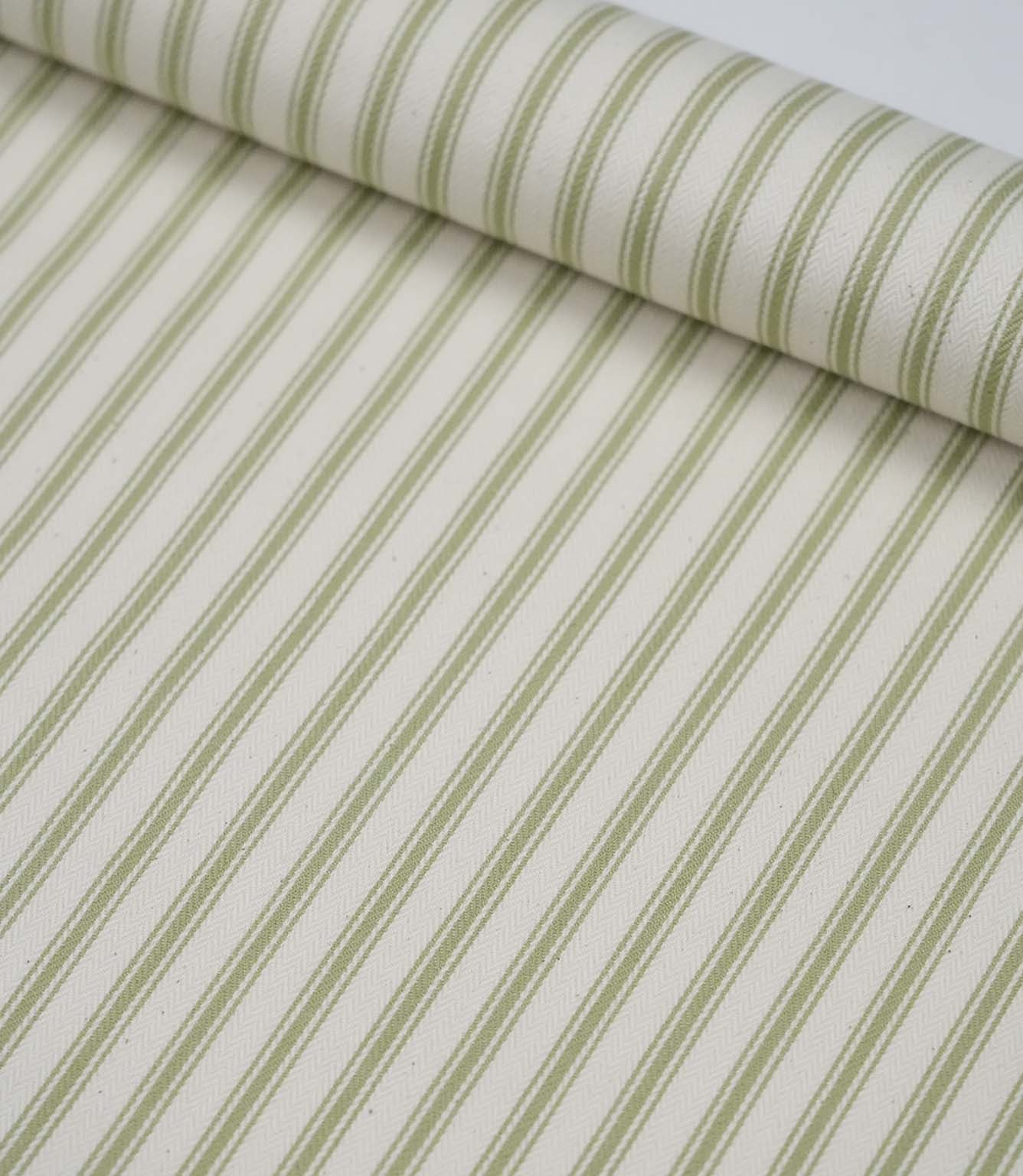 Rolled sage green ticking stripe fabric highlighting the classic striped design and subtle woven herringbone texture.