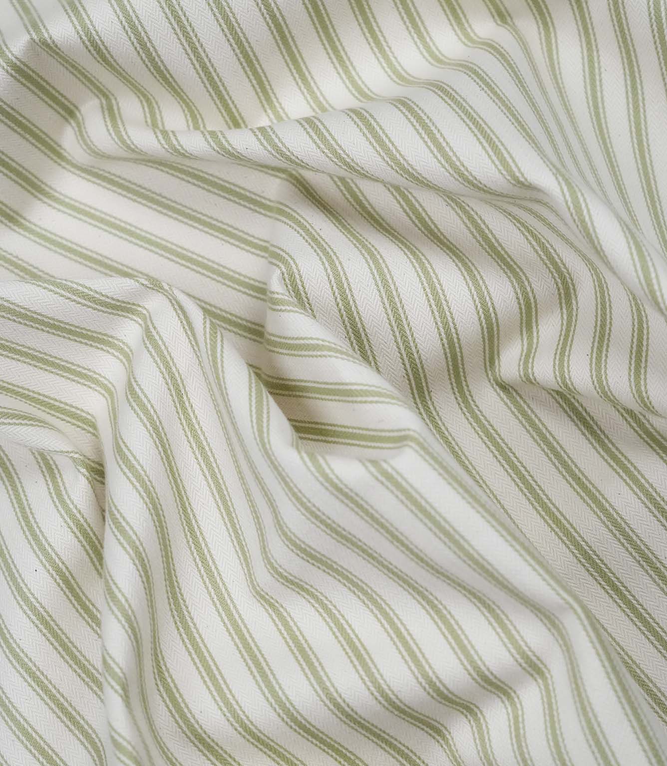 Sage green ticking stripe fabric draped to show its soft handle, elegant stripe pattern and woven herringbone texture.