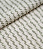 Folded sap green ticking stripe fabric showcasing the timeless striped pattern and premium woven herringbone finish.