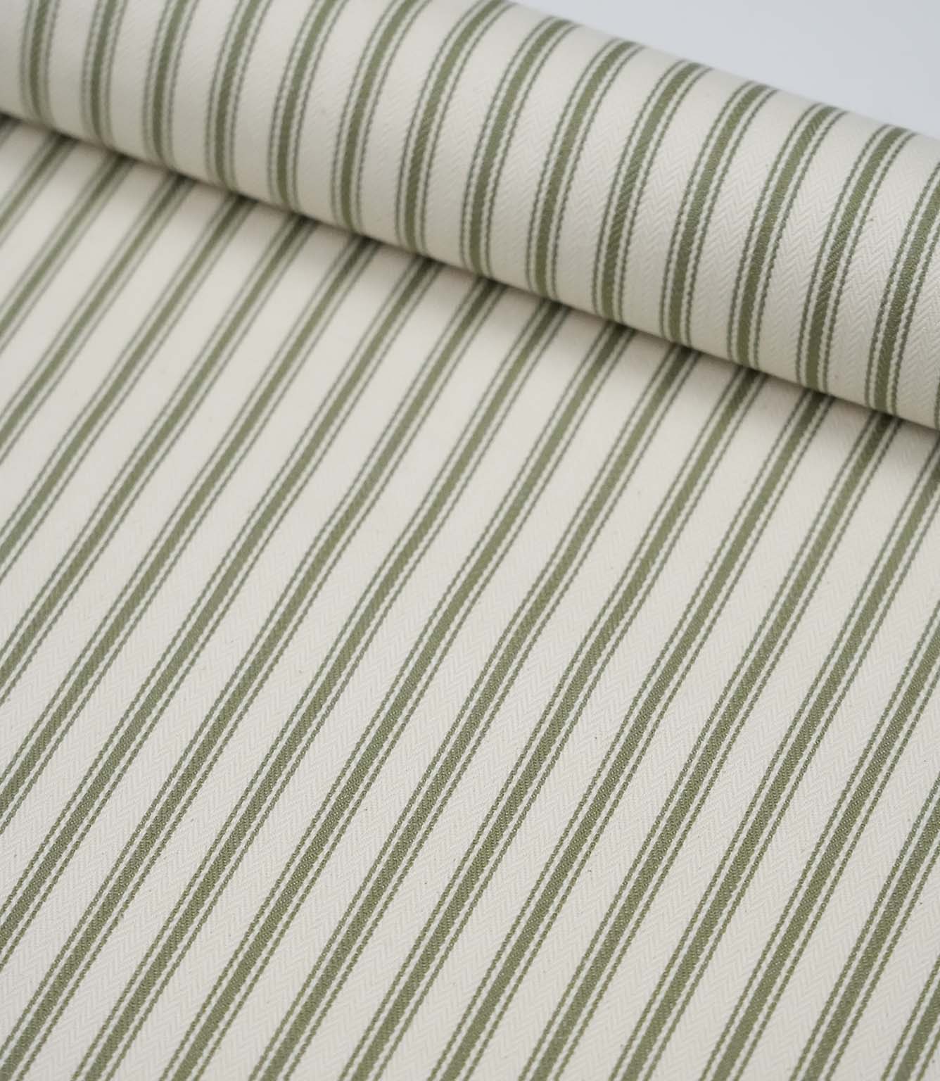 Sap green ticking stripe fabric draped to show its soft handle, elegant stripe pattern and woven herringbone texture.