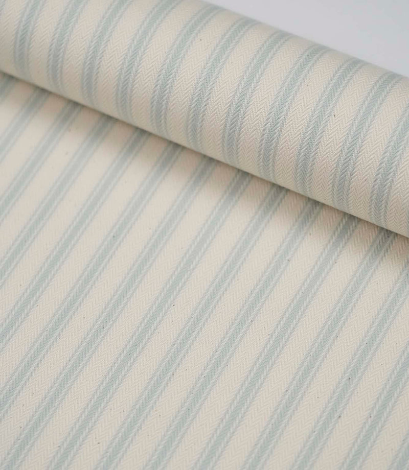 Rolled Sea Spray ticking stripe fabric displaying the classic blue stripe design and premium woven finish.