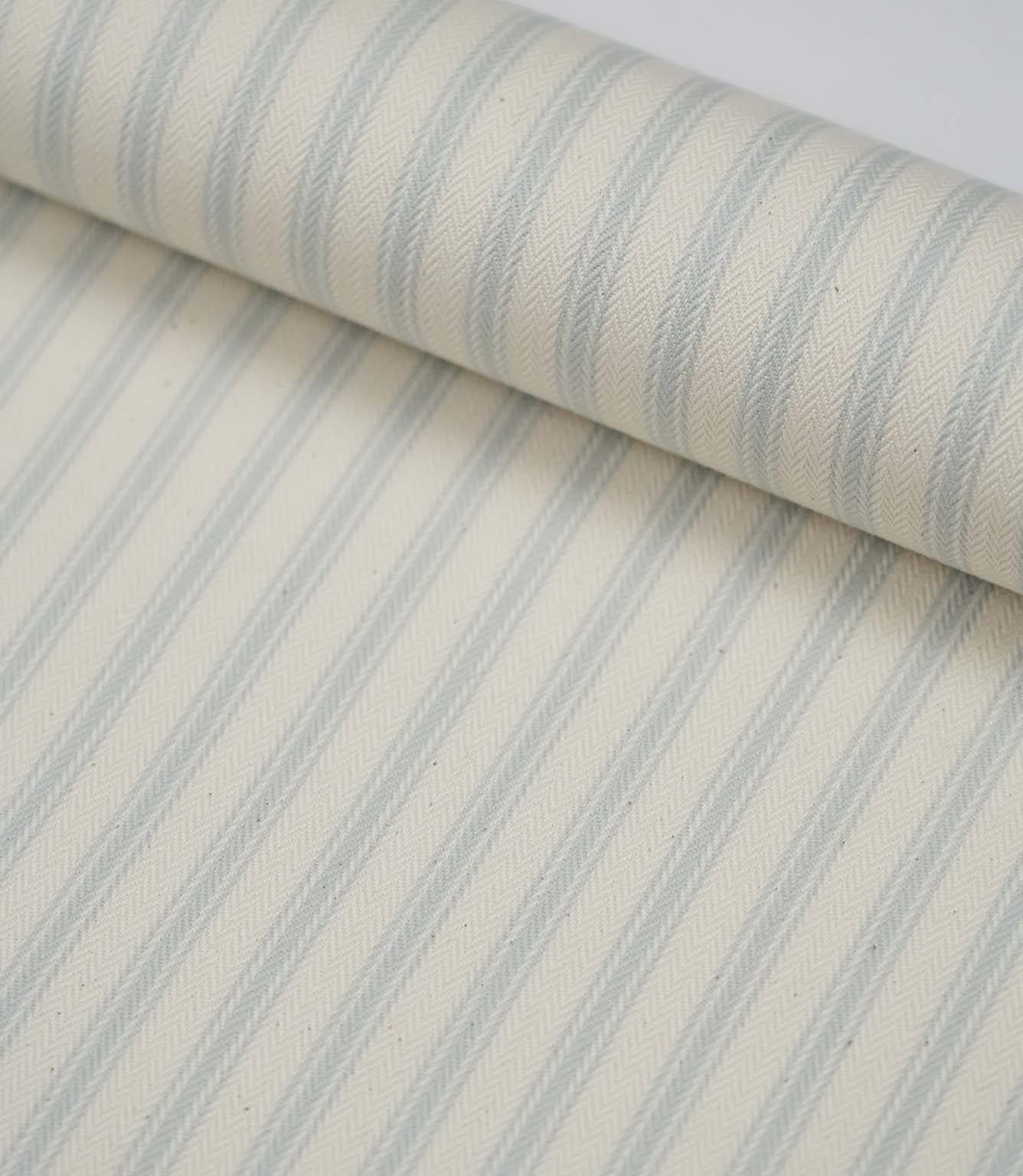 Rolled Sea Spray ticking stripe fabric displaying the classic blue stripe design and premium woven finish.