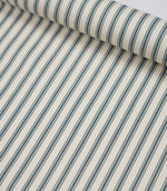 Rolled teal ticking stripe fabric highlighting the classic striped design and subtle woven herringbone texture.