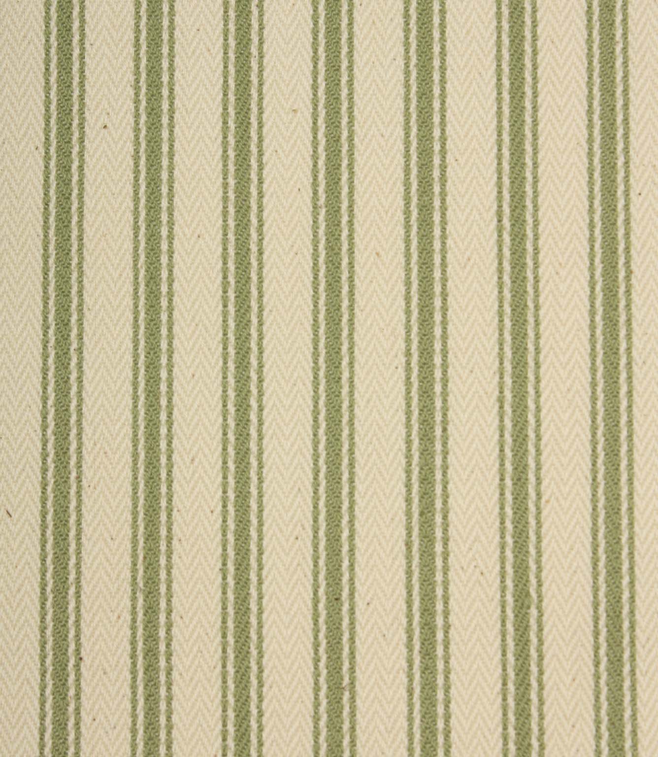 Close-up of ivory herringbone weave fabric featuring soft warm green ticking stripes and textured detailing.