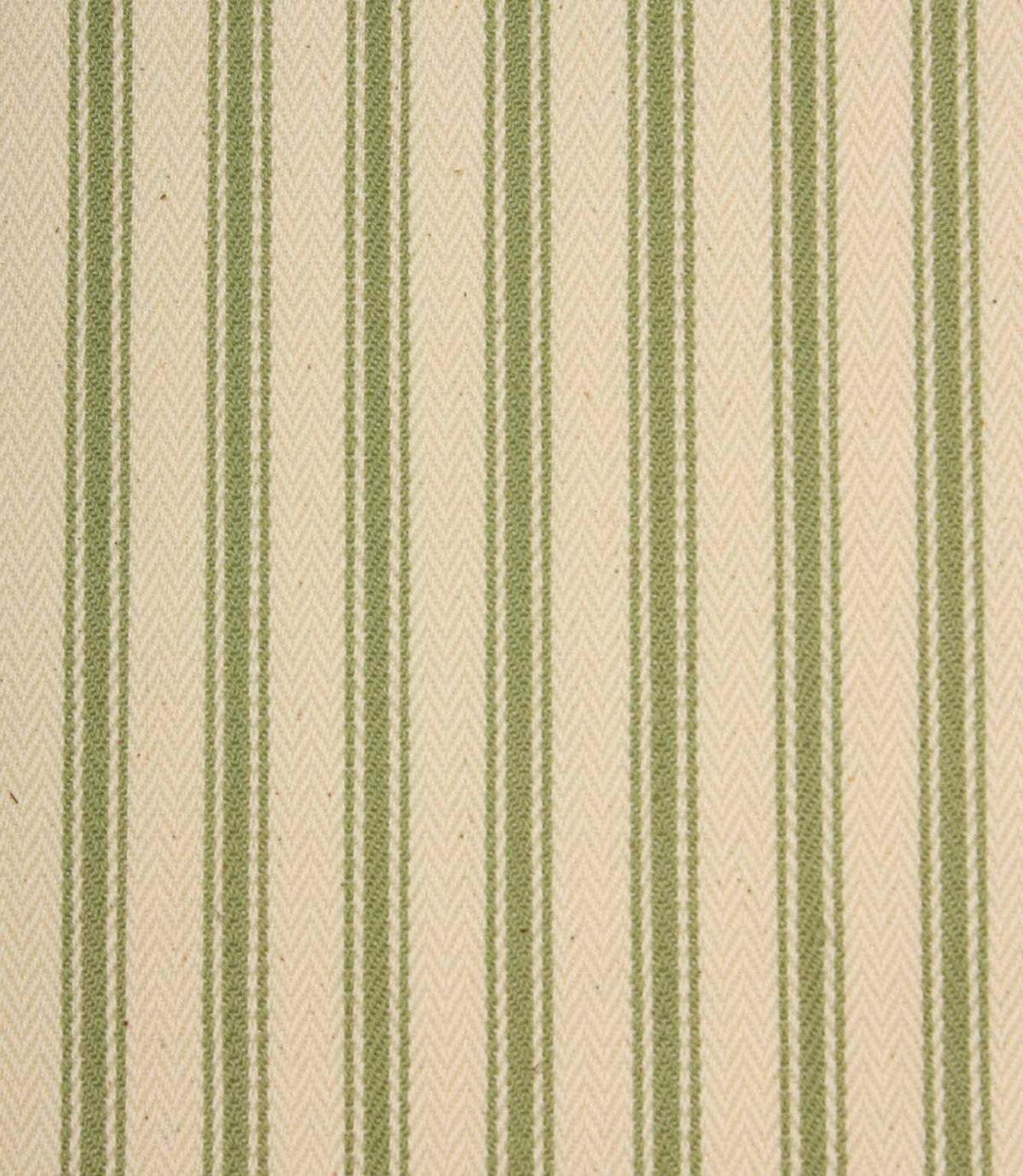 Close-up of ivory herringbone weave fabric featuring soft warm green ticking stripes and textured detailing.