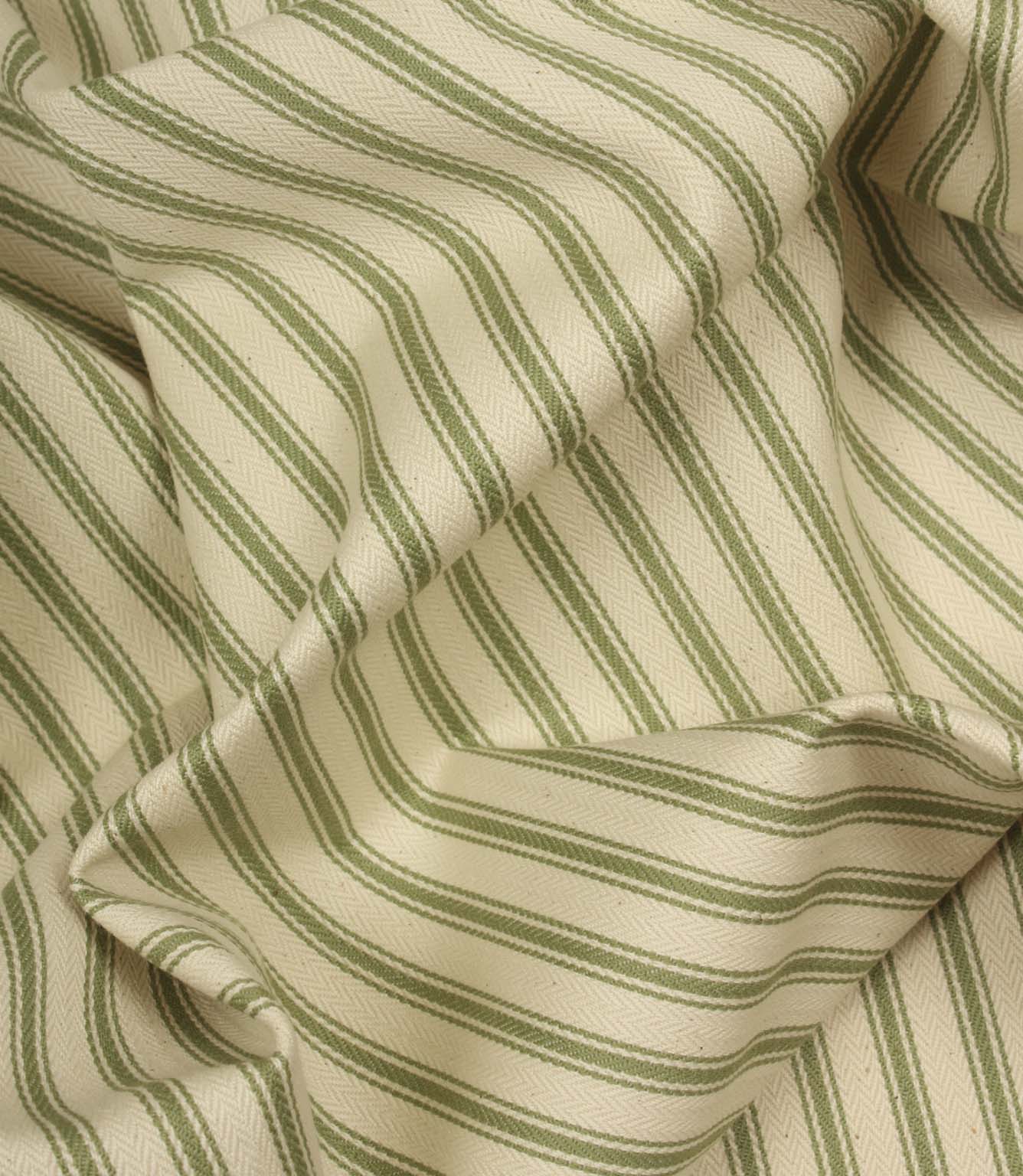 Draped warm green ticking stripe fabric highlighting soft folds and the timeless woven stripe pattern.