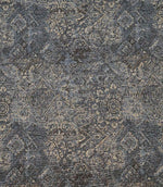 Blue Keshan tapestry upholstery fabric with an intricate distressed Persian-inspired pattern in soft blue, grey and beige tones.