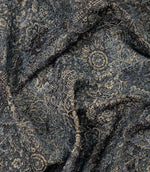 Blue Keshan tapestry fabric draped to display its elegant handle, woven texture and vintage Persian-inspired pattern.