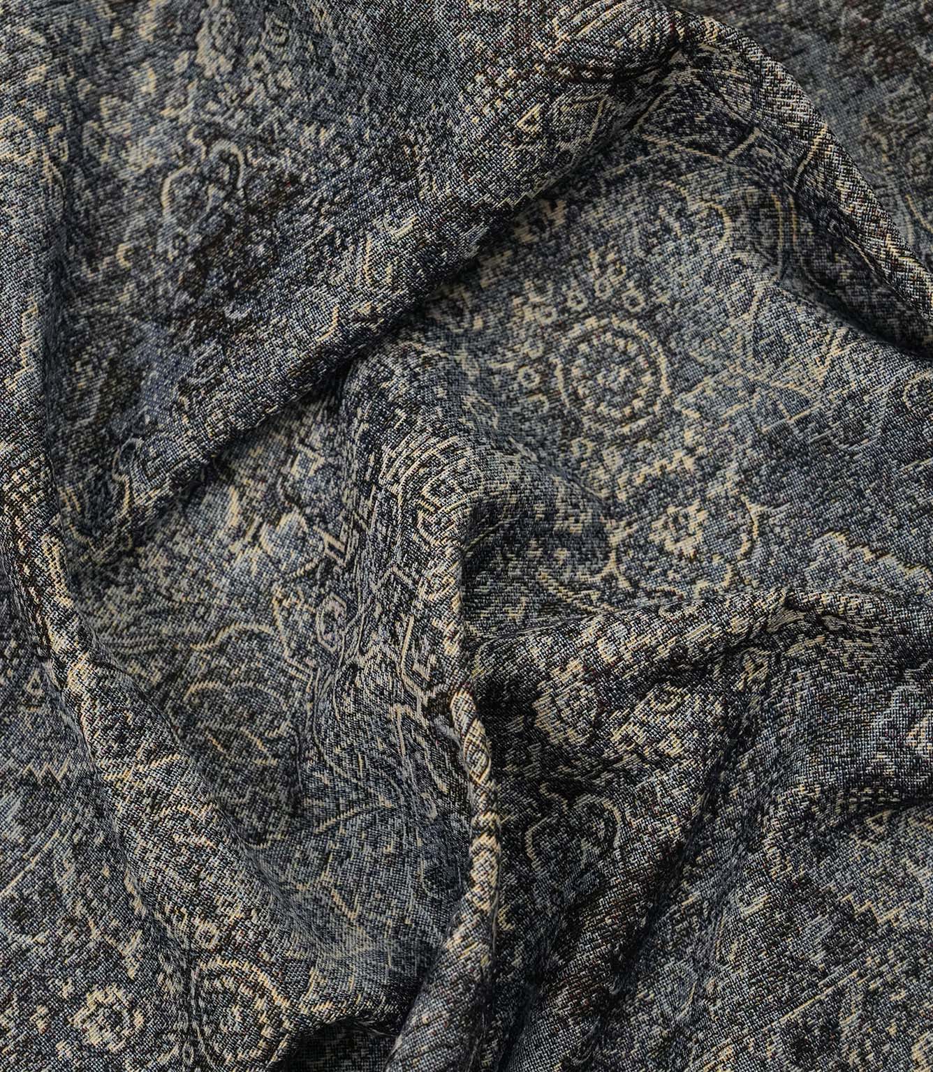 Blue Keshan tapestry fabric draped to display its elegant handle, woven texture and vintage Persian-inspired pattern.