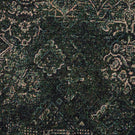 Close-up of green Keshan tapestry upholstery fabric featuring an intricate distressed Persian-inspired woven pattern.