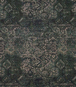 Green Keshan tapestry upholstery fabric with an all-over distressed Persian-style pattern in rich green, black and beige tones.