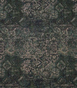 Green Keshan tapestry upholstery fabric with an all-over distressed Persian-style pattern in rich green, black and beige tones.
