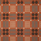 Kinfolk fabric shown flat, featuring a repeating geometric pattern in terracotta orange, charcoal black, soft grey and cream.