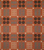 Kinfolk fabric shown flat, featuring a repeating geometric pattern in terracotta orange, charcoal black, soft grey and cream.