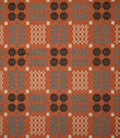 Kinfolk fabric shown flat, featuring a repeating geometric pattern in terracotta orange, charcoal black, soft grey and cream.