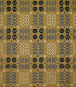 Kinfolk geometric fabric shown flat, with a mustard yellow ground and repeating charcoal, grey and cream woven motifs arranged in a structured pattern.