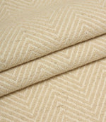 Close-up of beige fabric with a herringbone pattern