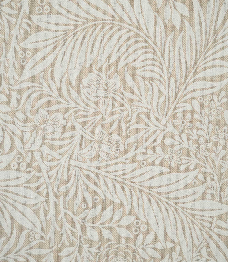 Close-up of Larkspur Linen Look fabric showing its textured weave and detailed cream botanical pattern of leaves, flowers and foliage on soft beige.