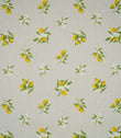 Lemon Grove Natural fabric featuring a repeating botanical print of bright yellow lemons, green leaves and delicate white citrus blossoms scattered across a natural beige woven background.