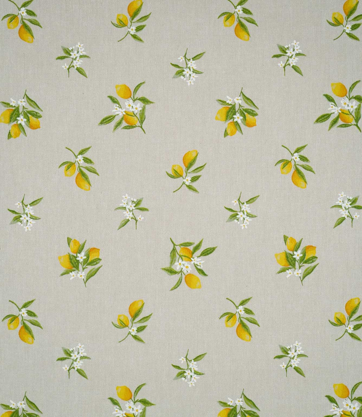 Lemon Grove Natural fabric featuring a repeating botanical print of bright yellow lemons, green leaves and delicate white citrus blossoms scattered across a natural beige woven background.