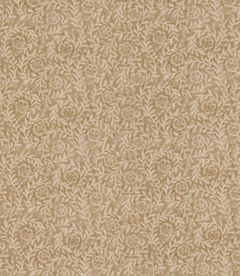 Manorville Dune floral fabric featuring an intricate repeating botanical pattern of delicate cream flowers, intertwining leafy vines and trailing foliage against a warm sandy beige background.