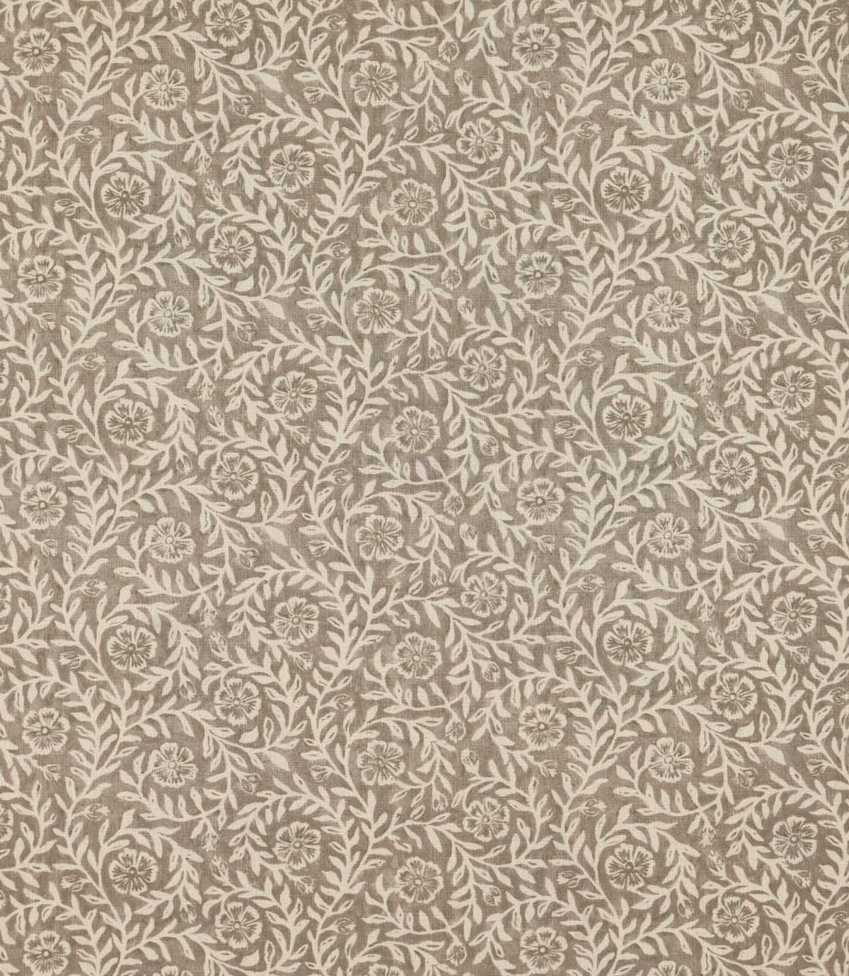 Manorville Quaker floral fabric featuring a repeating botanical pattern of delicate ivory flowers, trailing leafy branches and intertwining stems against a warm taupe and stone background with a subtle woven texture.