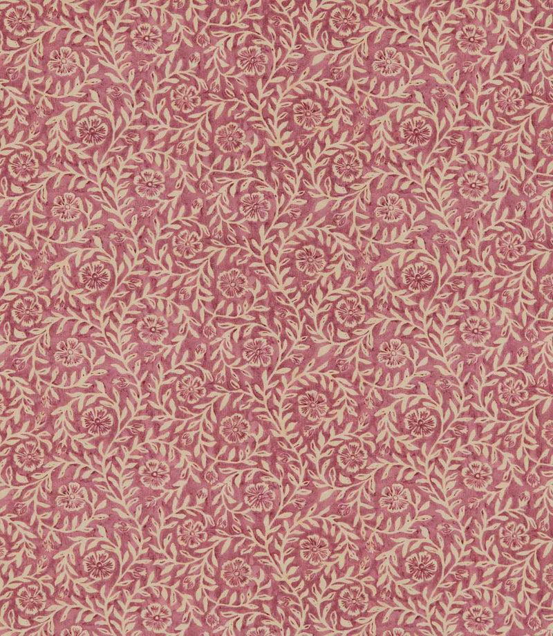 Manorville Rosehip floral fabric featuring a repeating botanical print of delicate cream flowers, trailing leafy branches and winding stems against a warm, dusty rose pink background with subtle tonal texture.