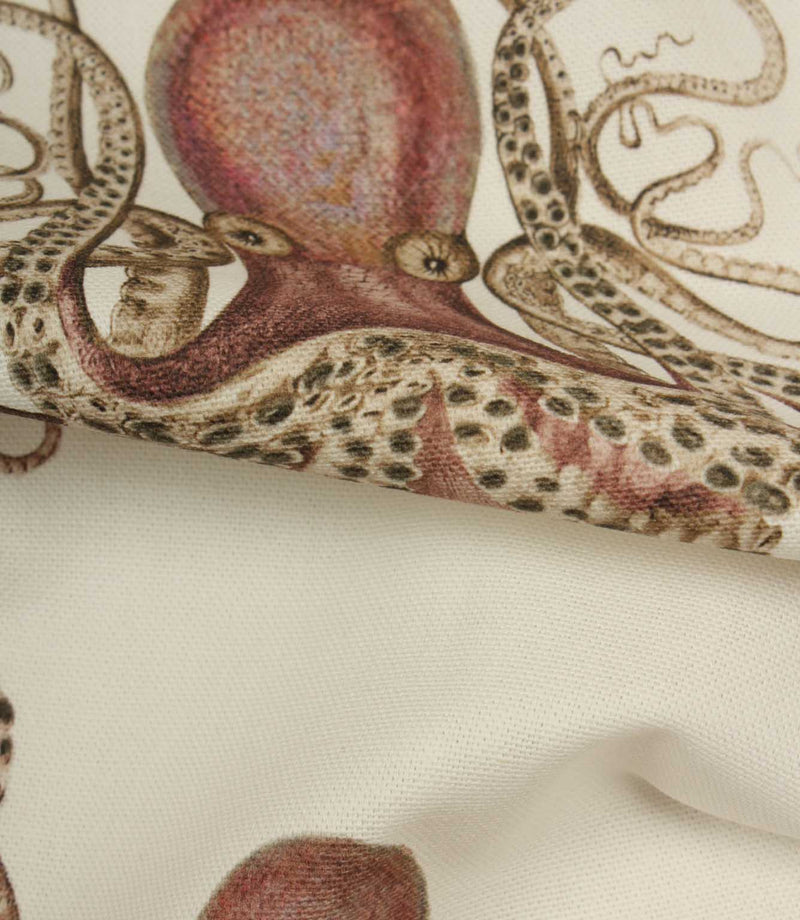 Close-up of a fabric with an octopus on a textured cream background