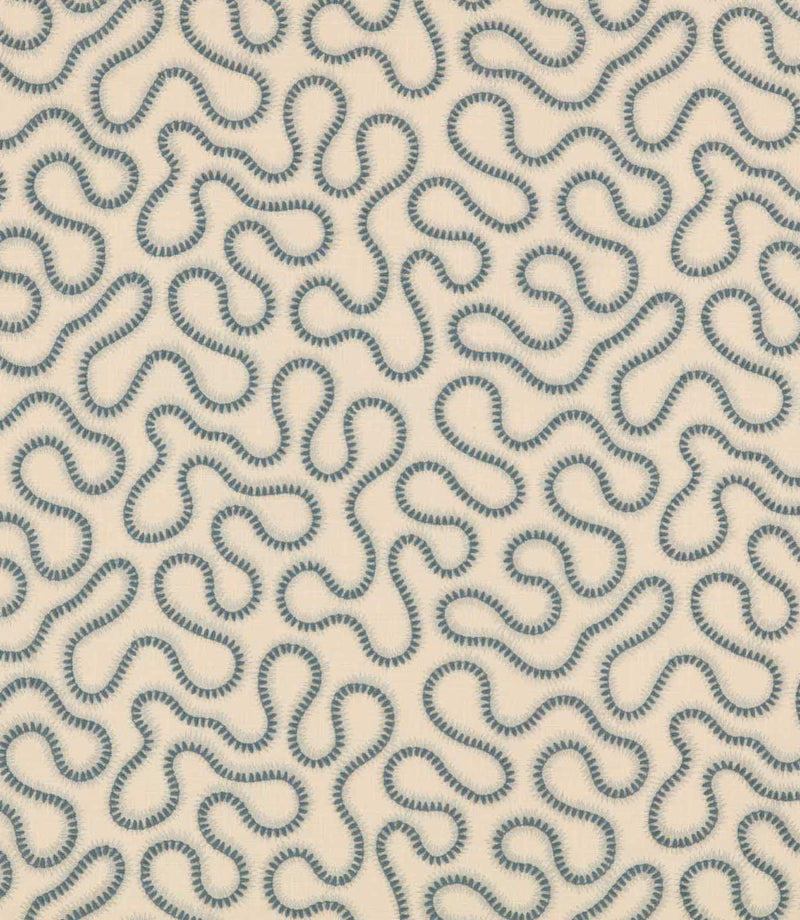 Orient Saltwater embroidered fabric with a repeating abstract squiggle pattern in muted blue on a soft cream woven background.