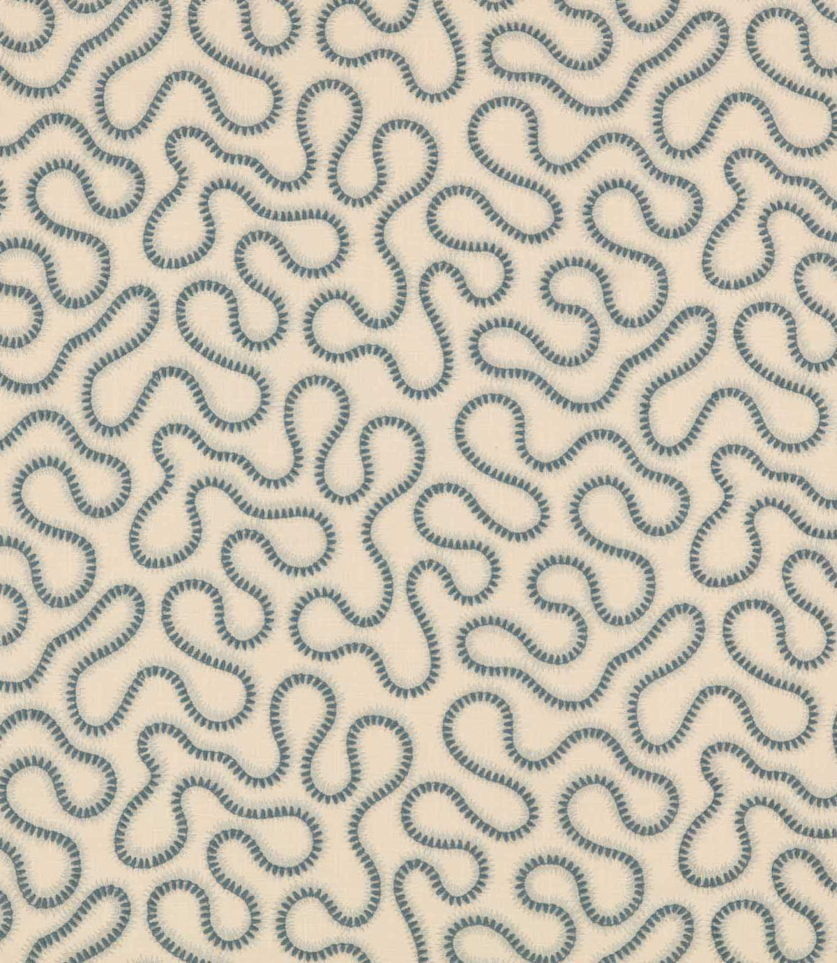 Orient Saltwater embroidered fabric with a repeating abstract squiggle pattern in muted blue on a soft cream woven background.