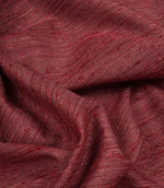 Otaru contemporary woven fabric draped in soft folds, displaying its texture and elegant movement in a red and pink shade.