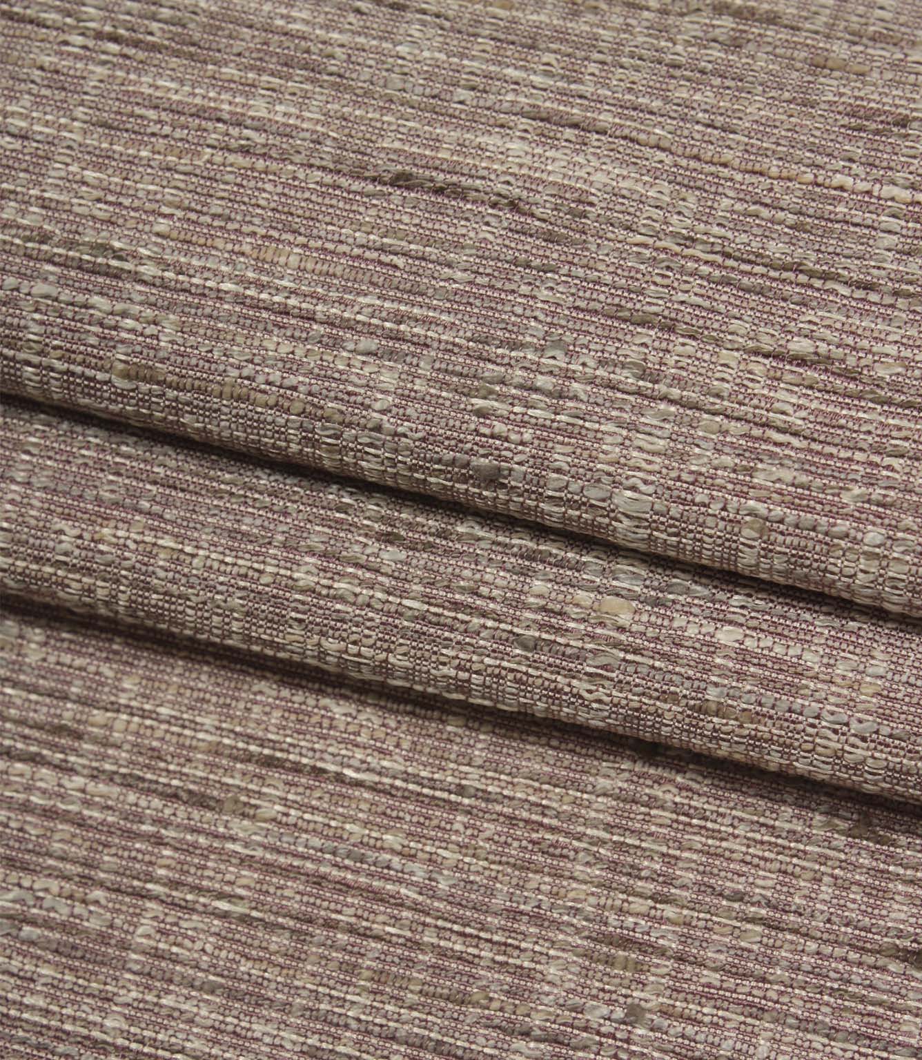 Folded Otaru woven fabric in a blush pink shade, displaying the fabric's textured weave and natural depth.