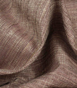 Otaru woven plain fabric draped in soft folds in blush pink, showing its elegant movement and tactile texture.