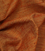Otaru contemporary woven fabric in sunset orange draped in soft folds, demonstrating its elegant movement and tactile texture.